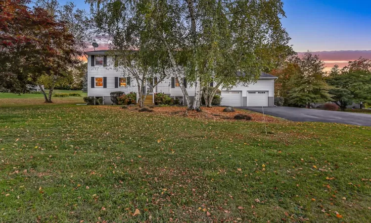 View of front of house featuring a lawn