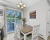 Dining room featuring a chandelier, light hardwood / wood-style flooring, and a baseboard radiator