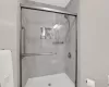 Bathroom with a shower with door