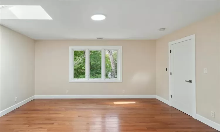 Master bedroom with a freestanding air jet/jacuzzi tub, a separate standing shower, and real oak hardwood flooring