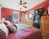 Bedroom featuring ornamental molding and ceiling fan