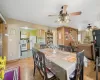 Dining space featuring ceiling fan, light hardwood / wood-style floors, and a textured ceiling