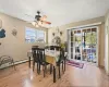 Dining space featuring ceiling fan, hardwood / wood-style flooring, a baseboard radiator, and a textured ceiling