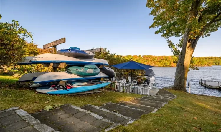 View of lakefront kayak racks and access to the lake