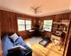 Office featuring ceiling fan, light wood-type flooring, crown molding, and a wealth of natural light