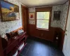 Entryway featuring wood walls