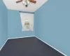 Unfurnished room featuring carpet and ceiling fan