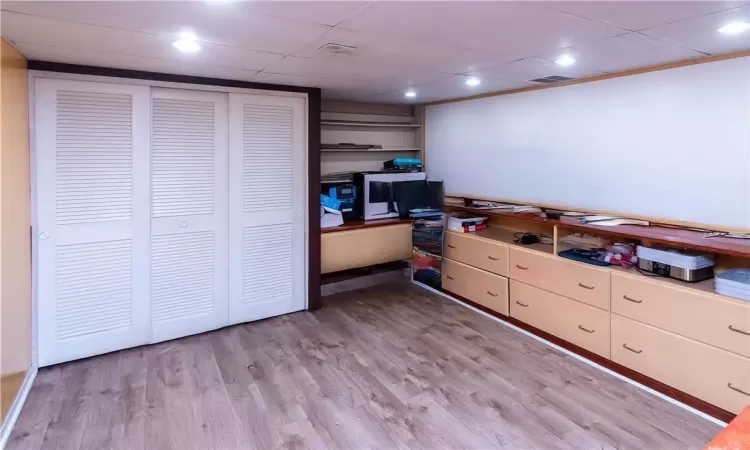 Home office featuring light hardwood / wood-style flooring