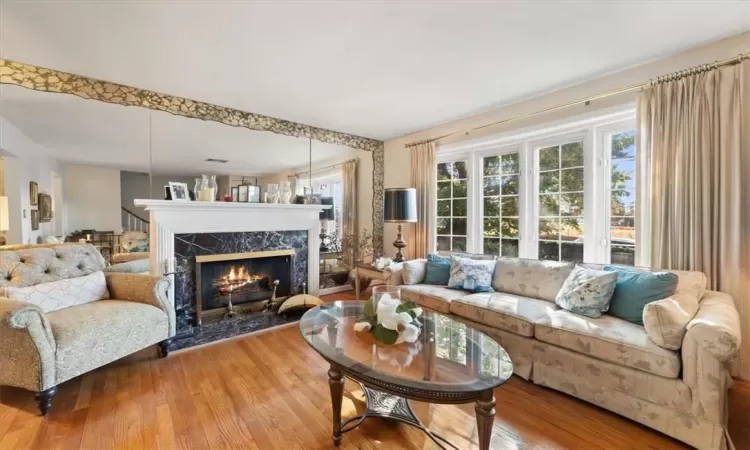 Large living room with beautiful fireplace.