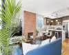 Living room featuring a fireplace, light hardwood / wood-style floors, and sink