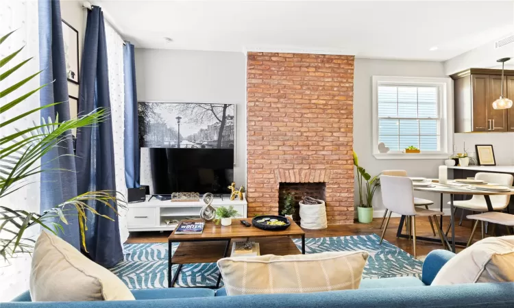 Living room featuring a fireplace and dark hardwood / wood-style floors