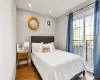 Bedroom featuring dark hardwood / wood-style flooring