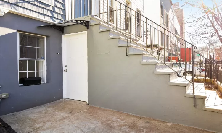 Property entrance with a patio