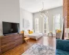 Bedroom featuring a notable chandelier and hardwood / wood-style flooring