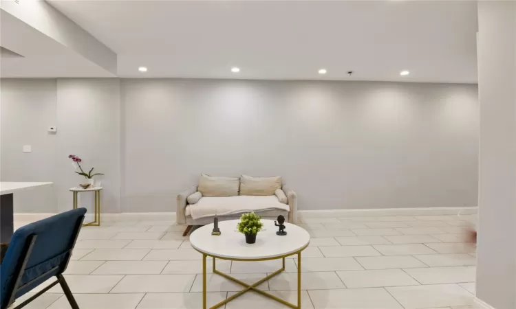 Living area featuring light tile patterned flooring