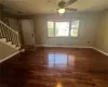 Entrance foyer featuring dark hardwood / wood-style floors and ceiling fan