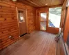 Unfurnished sunroom with wooden ceiling