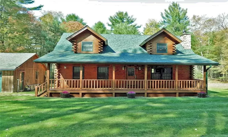 View of front of house featuring a front lawn