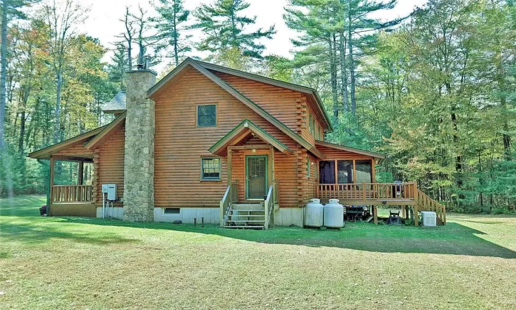 Cabin with a front yard