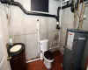 1/2 Bath with water heater, toilet and sink