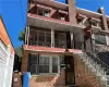 View of front of house with a balcony