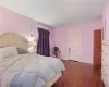 Bedroom featuring dark wood-type flooring