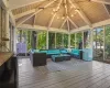 Sunroom / solarium with wooden ceiling and vaulted ceiling with beams