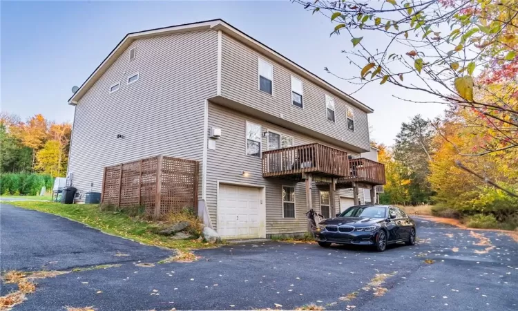 Rear view of house with a garage