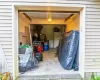 Garage featuring white fridge