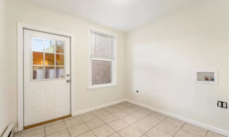 Laundry room with washer and dryer hook up.