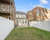 Back of house featuring a patio area and a yard