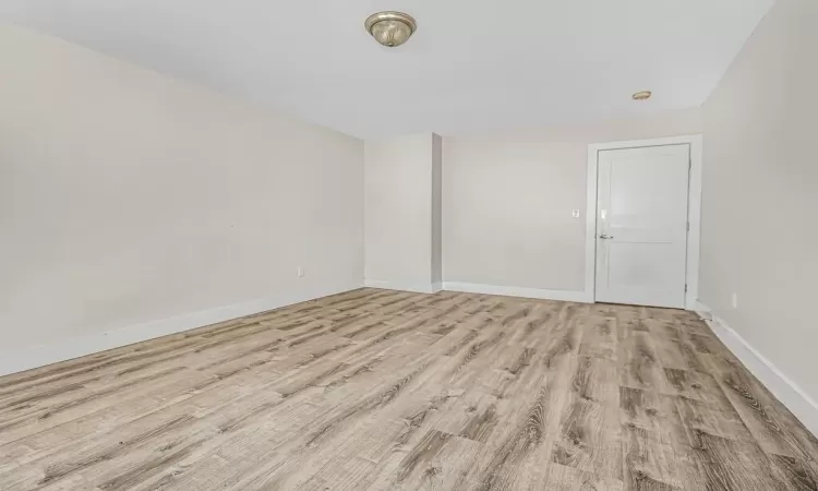 Empty room featuring light hardwood / wood-style flooring