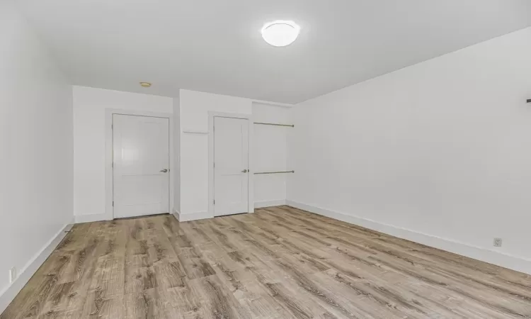 Unfurnished bedroom featuring light hardwood / wood-style flooring