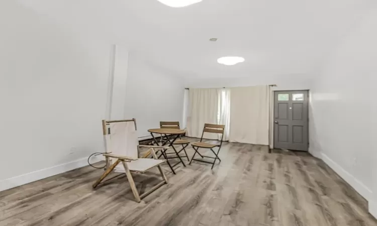 Living area with hardwood / wood-style flooring