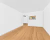 Spare room with light hardwood / wood-style floors and ceiling fan