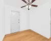 Empty room with wood-type flooring and ceiling fan