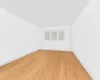 Unfurnished room with light hardwood / wood-style flooring