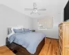 Bedroom with wood-type flooring and ceiling fan