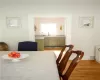 Dining area with sink and light wood-type flooring