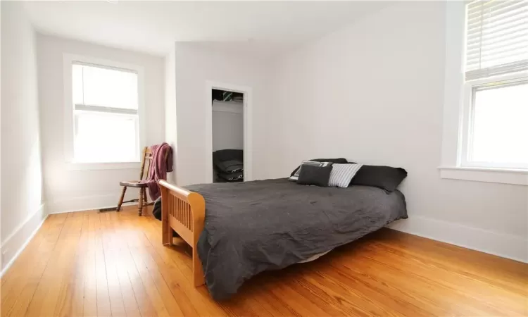 Bedroom featuring hardwood / wood-style flooring and a closet