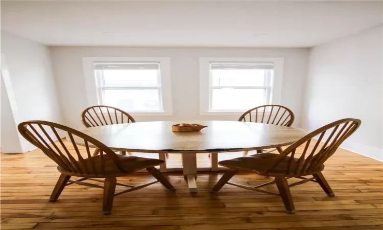 Dining room with light hardwood / wood-style flooring