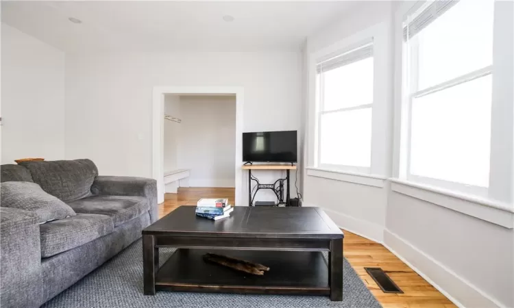 Living room featuring hardwood / wood-style flooring and a wealth of natural light