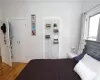 Bedroom featuring wood-type flooring