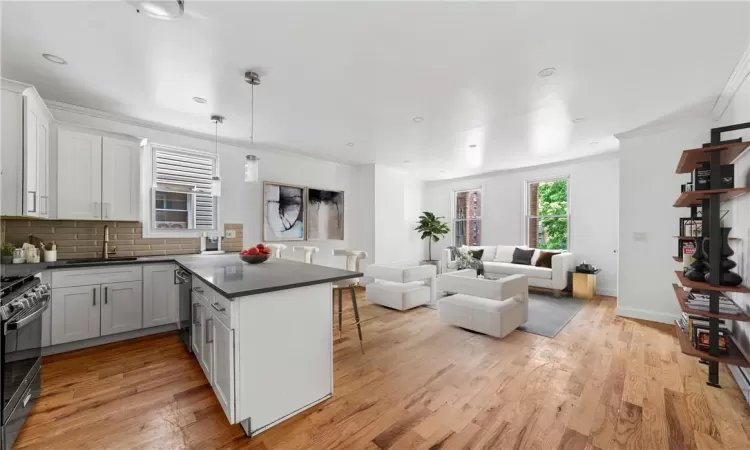 Kitchen featuring white cabinetry, appliances with stainless steel finishes, sink, and kitchen peninsula