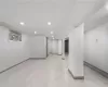 Basement with light tile patterned floors