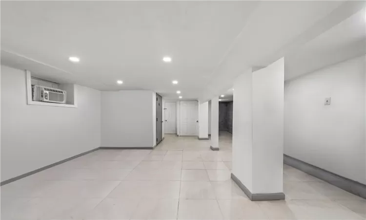 Basement with light tile patterned floors