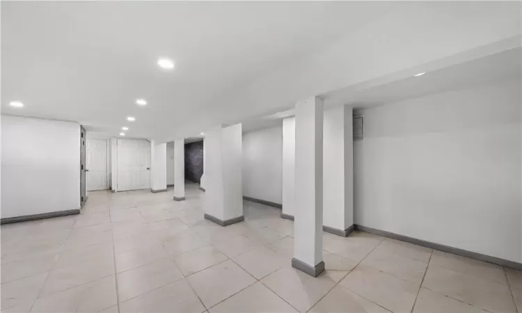 Basement with light tile patterned floors