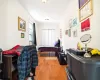 Bedroom featuring a closet, ornamental molding, and light hardwood / wood-style flooring