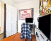 Office space with ornamental molding and wood-type flooring