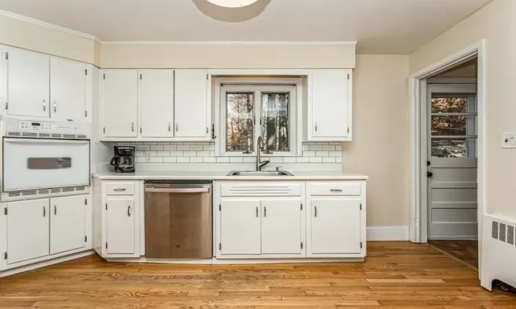 Ample kitchen cabinets and built-in oven.